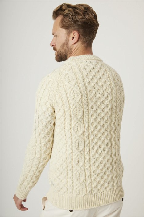 Image of model wearing Hudson Aran Jumper. Model is 6ft1in, chest size 38in and wearing size Large