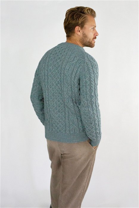 Image of model wearing Hudson Aran Jumper. Model is 6ft1in, chest size 40in and wearing size Large