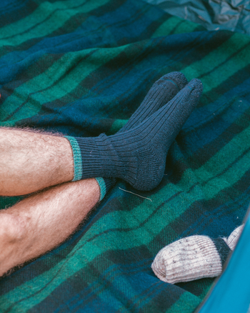 Image of model wearing Boot Socks. Small - UK4-7/ Large - UK 8-12