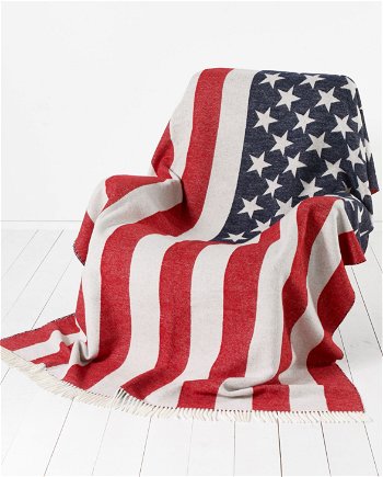 Image of model wearing USA Stars & Stripes Wool Blanket. Size: 200cm x 135cm (includes fringe)