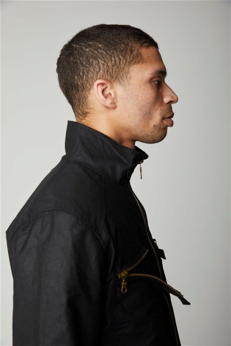 Image of model wearing Wallace Waxed Zipper. Model is 6ft, chest size 36in and wearing size Large