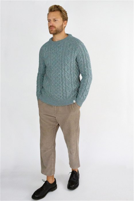 Image of model wearing Hudson Aran Jumper. Model is 6ft1in, chest size 40in and wearing size Large