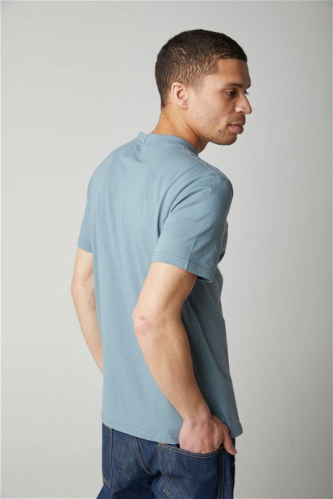 Image of model wearing Classic T-Shirt. Model is 6ft, chest size 36in and wearing size Medium