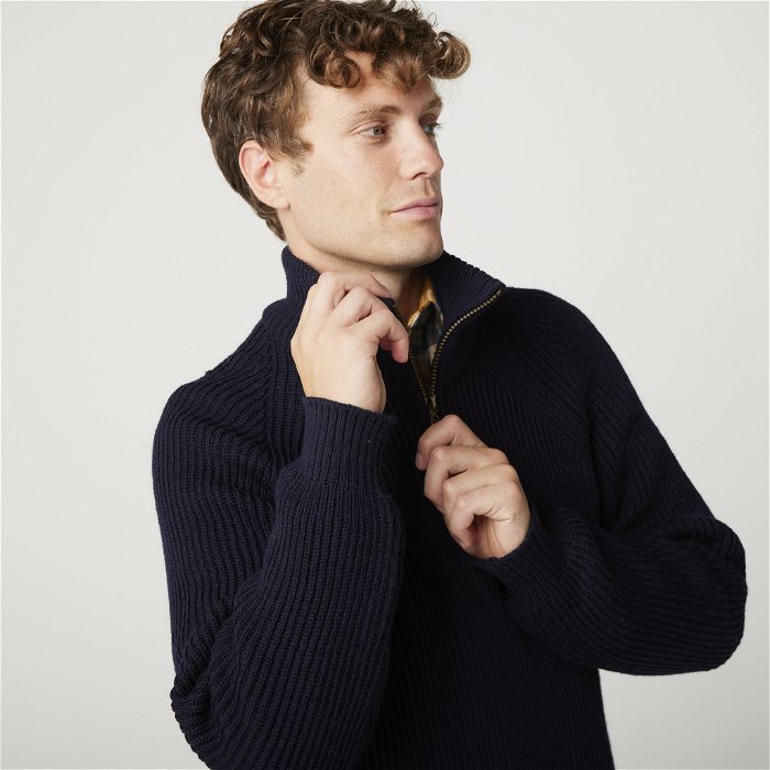 Image of model wearing Ford Zip Neck. Model is 6ft1in, chest size 38in and wearing size Medium