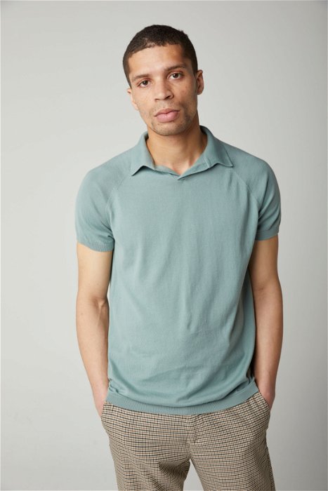 Image of model wearing Knitted Emery Polo Shirt. Model is 6ft, chest size 36in and wearing size Medium