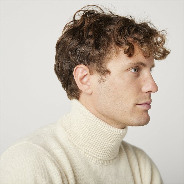Image of model wearing Makers Stitch Polo Neck. Model is 6ft1in, chest size 38in and wearing size Medium 