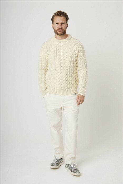 Image of model wearing Hudson Aran Jumper. Model is 6ft1in, chest size 38in and wearing size Large